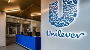 The blue Unilever sign next to the desk inside de head office in Rotterdam, the Netherlands.