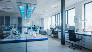 Modern Medical Research Laboratory with Computer, Microscope, Glassware with Biochemicals on the Desk. Scientific Lab Biotechnology Development Center Full of High-Tech Equipment. Biomedical technology stocks, RSLS Stock