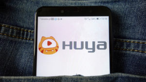 the HUYA logo displayed on a mobile phone